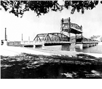 A picture of the St Croix river and historic bridge.
